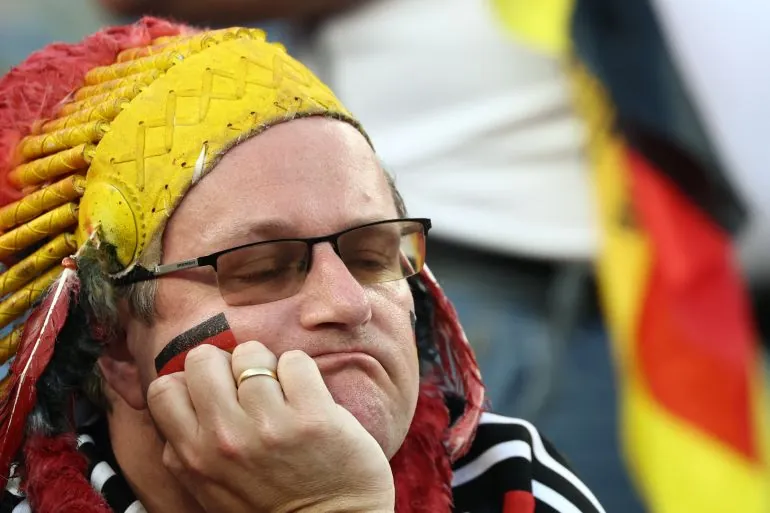 TOPSHOT - A Germany fan reacts after his team’s losing the penalty shootout during the 2026 World Cup round of 32 football match between Germany and Paraguay at the Boston Stadium in Foxborough on June 29, 2026.